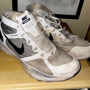 Nike running shoes with no lace on one shoe